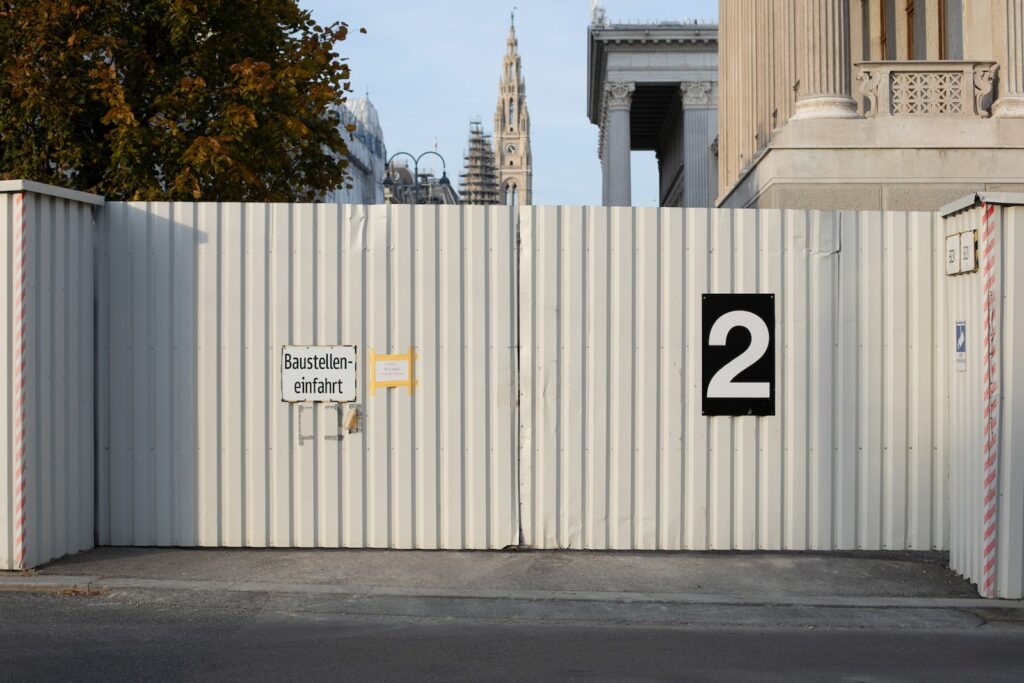 a white fence with a number on it